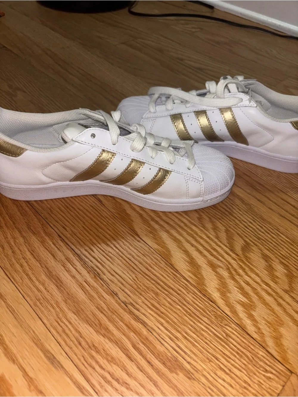 adidas Women's White Sneakers with Gold Stripe Accents
